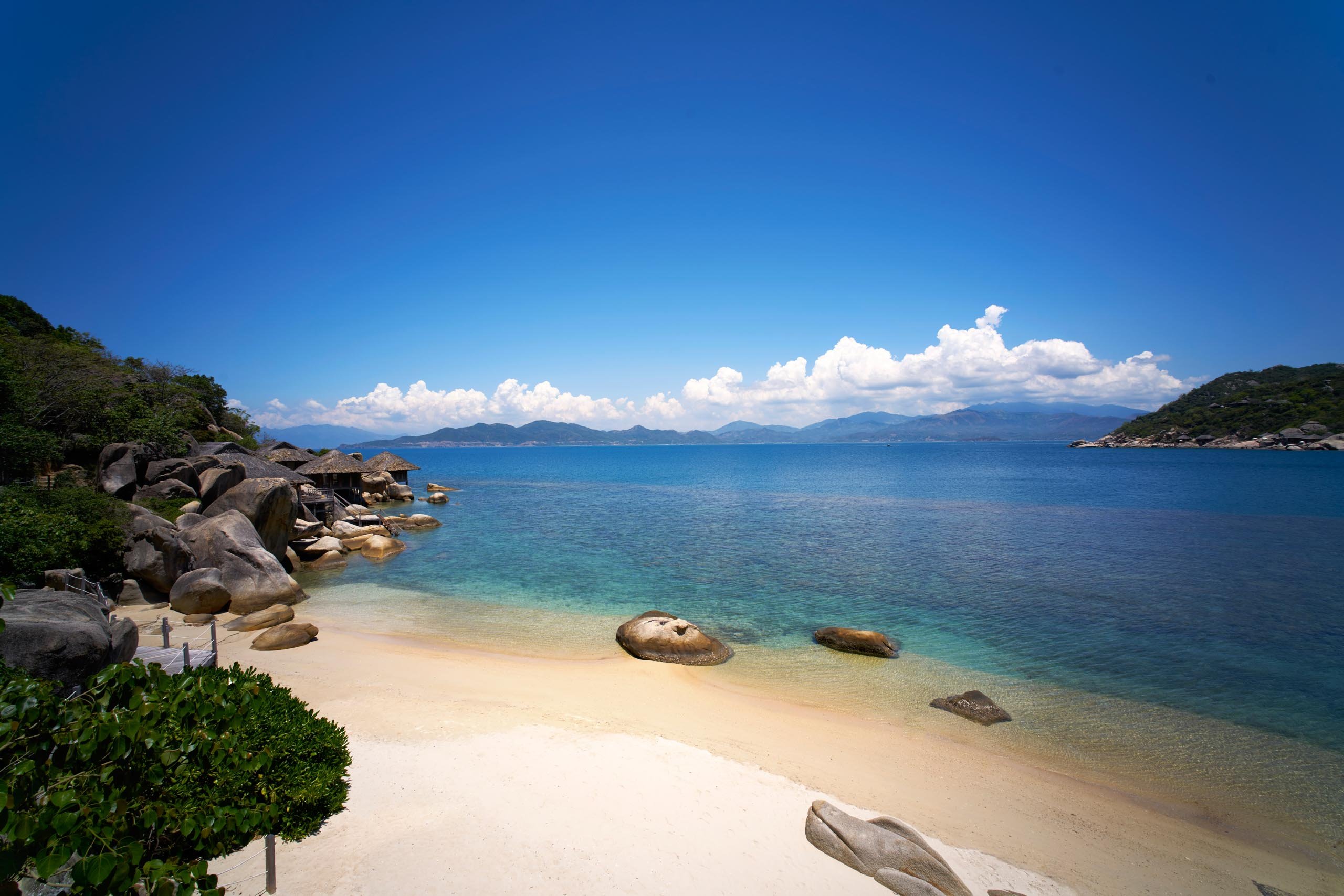 Photo of Six Senses Ninh Van Bay Beach with turquoise pure water surface