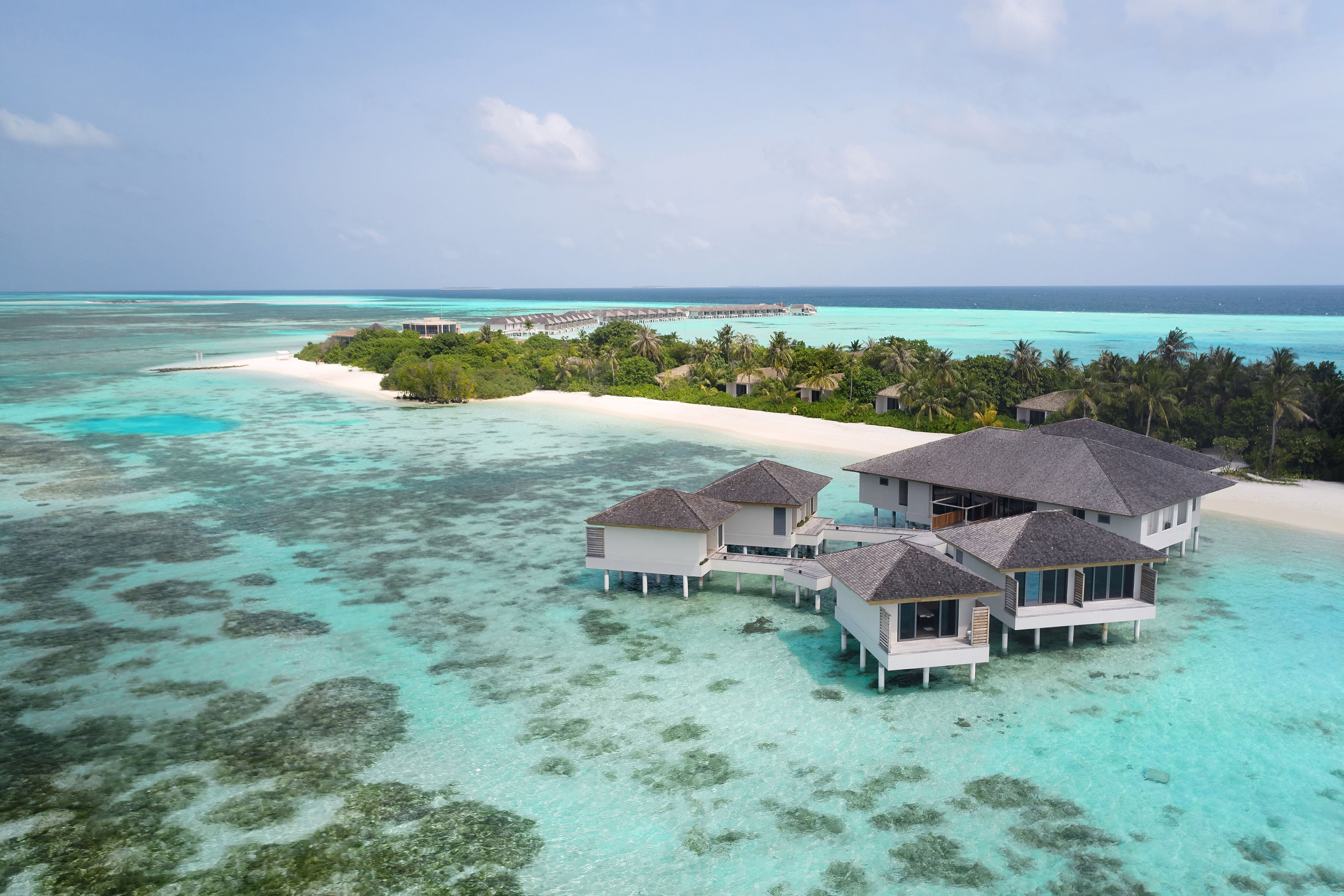 Photo de Plage de l'île Thilamaafushi avec sable fin et lumineux de surface
